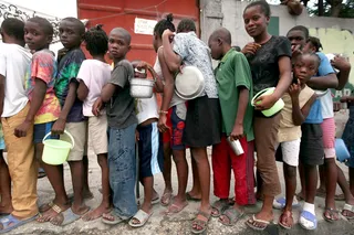 Strength in Numbers - The race to bring food and clean water to the Haitian people became frantic as the threat of dehydration and waterborne diseases became a grim reality.&nbsp;(Photo: Joe Raedle/Getty Images)