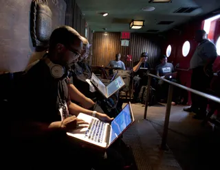 Set list. - DJs lined up inside the Hiro Ballroom in NYC to put the final touches on their set lists.  (Photo: Moses Mitchell/BET)