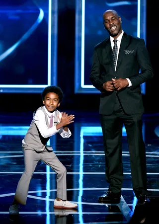 Two Generations - Black-ish star and pint-sized actor Miles Brown emulates Gary Payton as they present the award for Best Defender.&nbsp;(Photo: Ethan MIller/BET/Getty IMages)