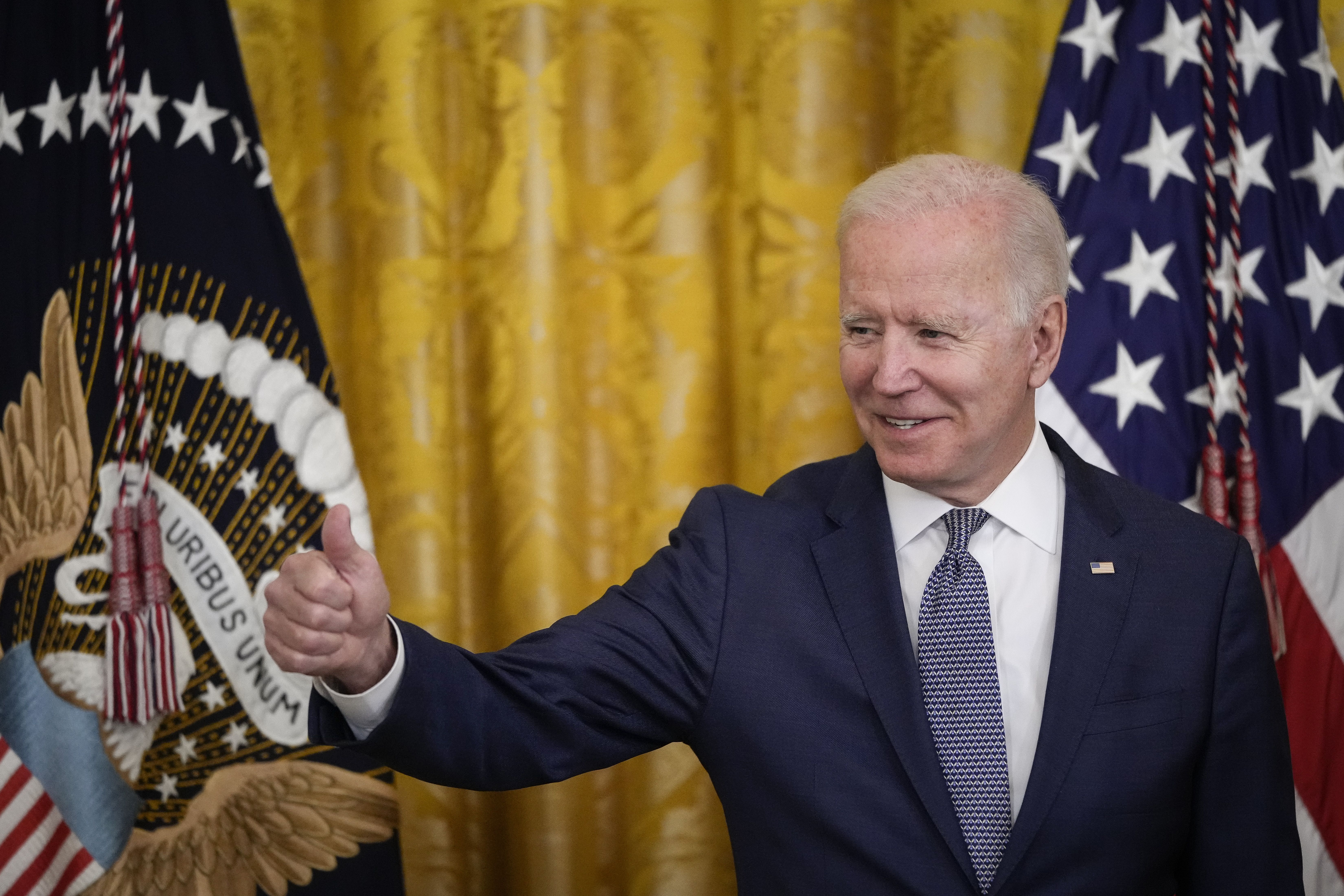 WASHINGTON, DC - JUNE 17: U.S. President Joe Biden gives the thumbs up to the audience before signing the Juneteenth National Independence Day Act into law in the East Room of the White House on June 17, 2021 in Washington, DC. The Juneteenth holiday marks the end of slavery in the United States and the Juneteenth National Independence Day will become the 12th legal federal holiday â the first new one since Martin Luther King Jr. Day was signed into law in 1983. (Photo by Drew Angerer/Getty Images)