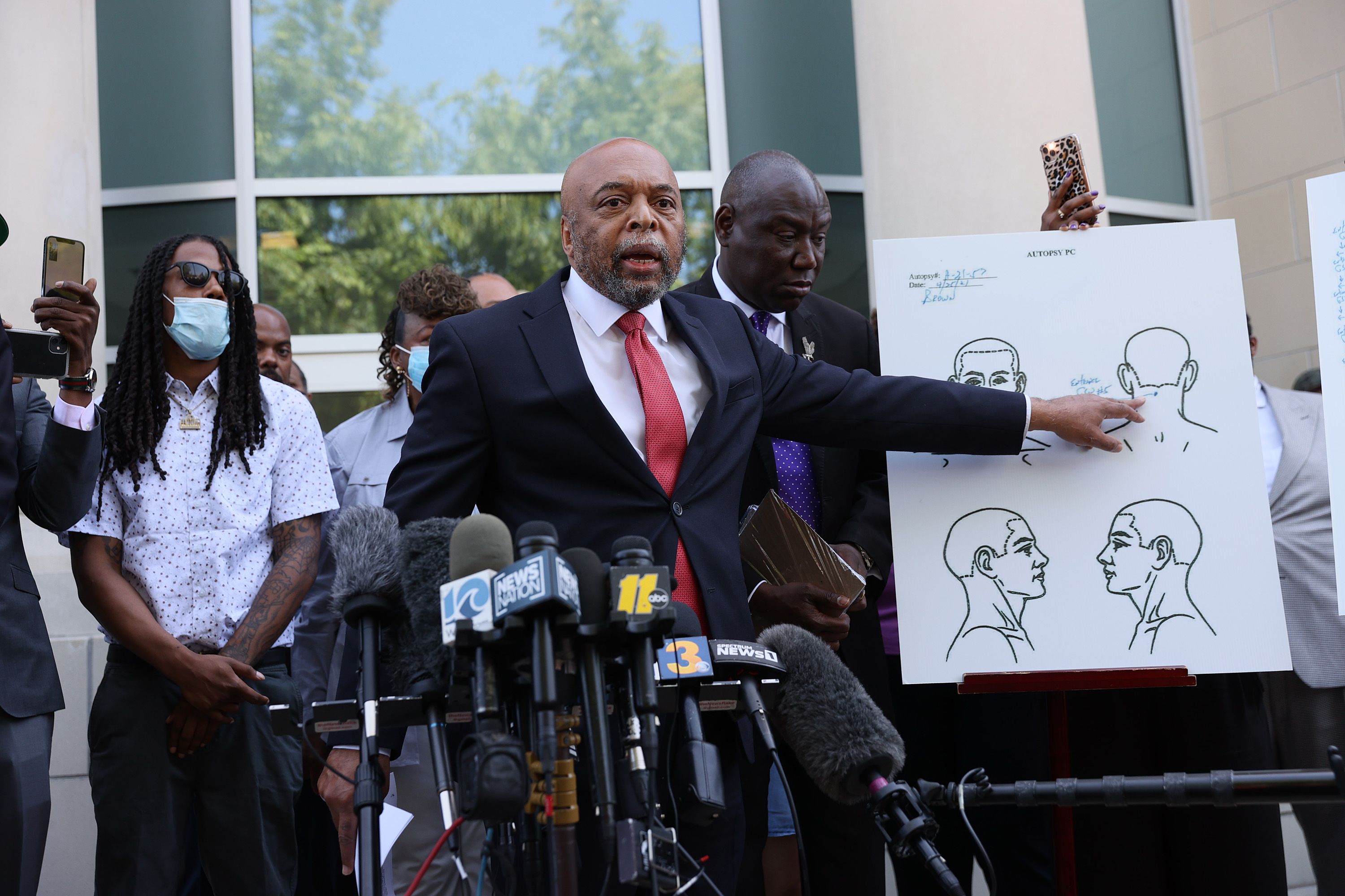 ELIZABETH CITY, NORTH CAROLINA - APRIL 27:  Wayne Kendall, one of the lawyers representing the family of Andrew Brown Jr.,  points to an autopsy chart that his team conducted showing where Mr. Brown was shot on April 27, 2021 in Elizabeth City, North Carolina. Mr. Kendall and family members spoke to the media about the 20 seconds of police body camera footage they were shown and an autopsy they performed after the shooting death of Andrew Brown Jr. on April 21 by Pasquotank County Sheriff deputies. (Photo by Joe Raedle/Getty Images)