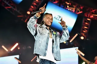 Fetty Wap Scanning the Crowd for his Trap Queen - Fetty Wap takes a few seconds between songs to search for his Trap Queen in the crowd.(Photo: Alberto Rodriguez/BET/Getty Images for BET)&nbsp;