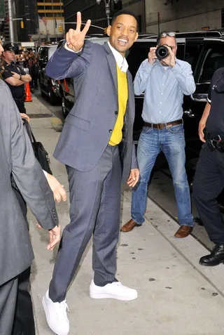 Million Dollar Smile - Will Smith has been traveling all over the globe to promote the third installment of his hit movie franchise&nbsp;Men in Black. Smith flashes his trademark smile and gives a peace sign as he heads into the Late Show with David Letterman in New York City.   (Photo: Enrique Rc, PacificCoastNews.com)