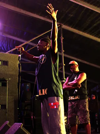 Public Enemy - Flavor Flav of Public Enemy raising it up to get the party started during their performance at Fun Fun Fun Fest.&nbsp;(Photo: Candice Lawler / BET)