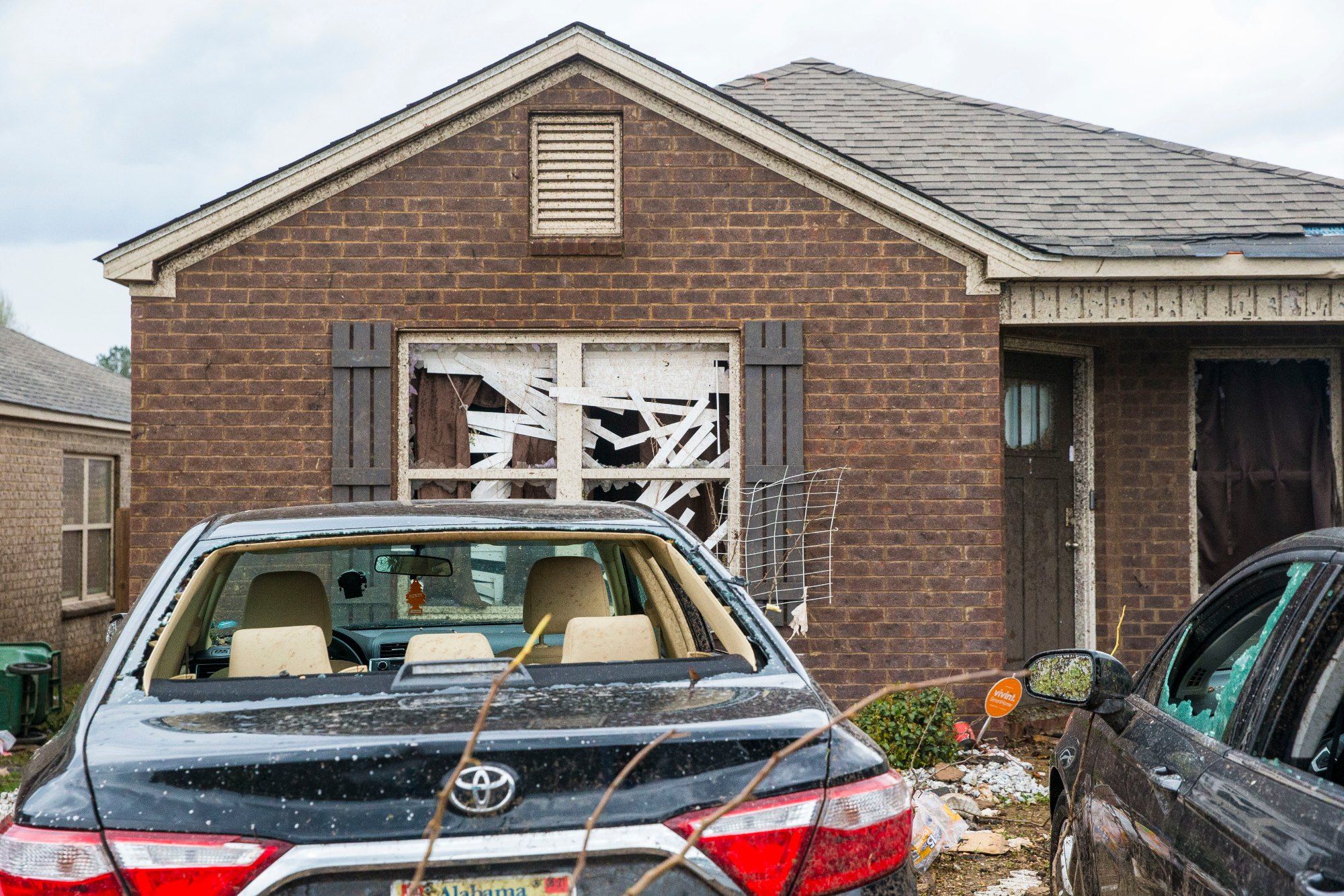 Homes and cars on Waterbury Drive were heavily damaged as tornado activity hit numerous sites, Wednesday, March 17, 2021, in Moundville, Ala. (AP Photo/Vasha Hunt)