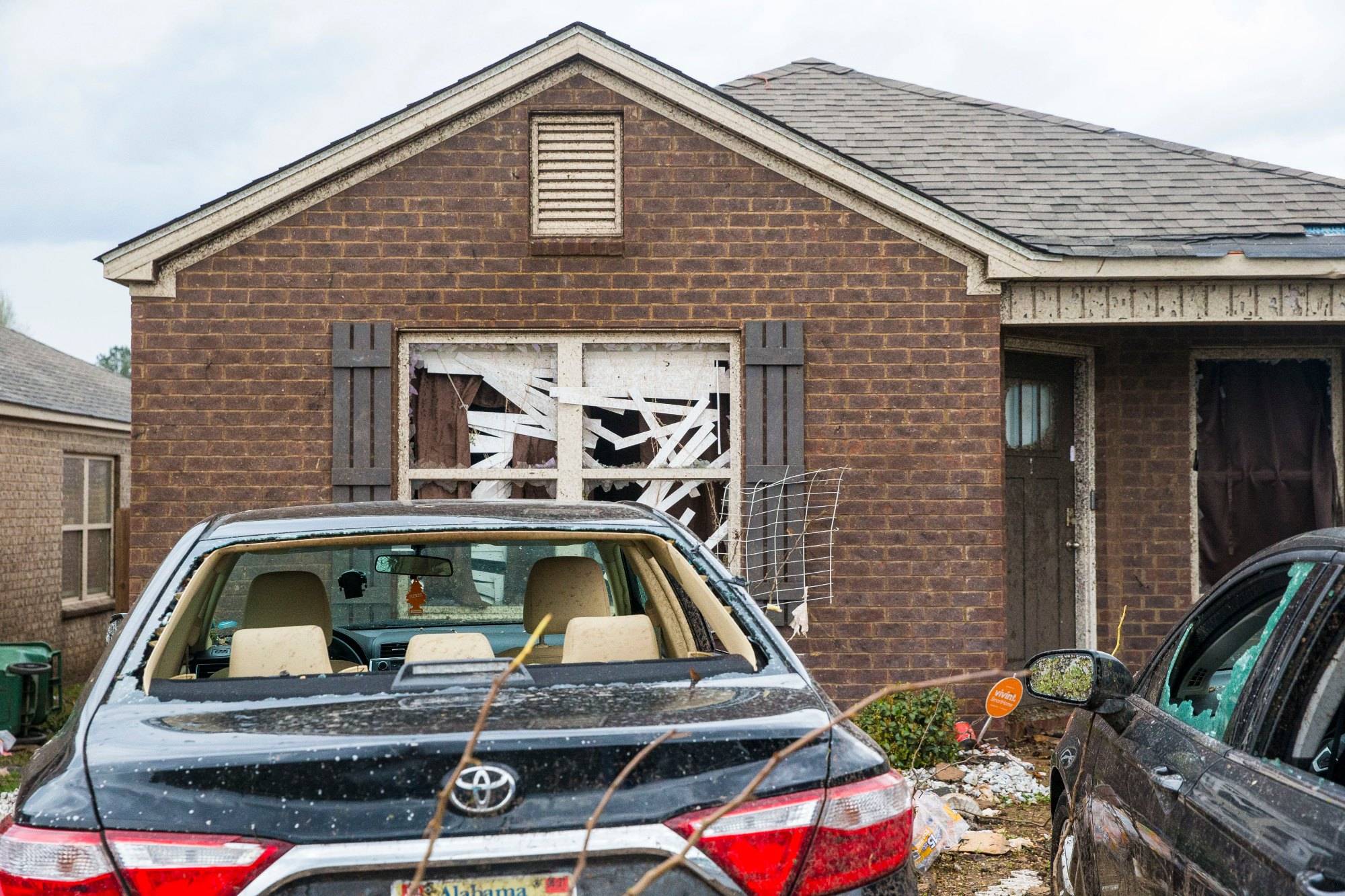 Homes and cars on Waterbury Drive were heavily damaged as tornado activity hit numerous sites, Wednesday, March 17, 2021, in Moundville, Ala. (AP Photo/Vasha Hunt)