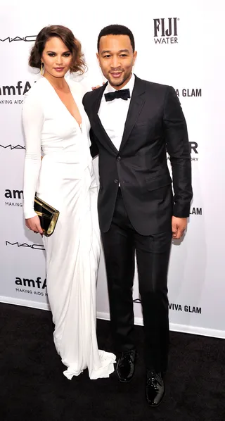 Fashion Forward - John Legend and fiancée Chrissy Teigen attend the amfAR New York Gala to kick off Fall 2013 Fashion Week at Cipriani Wall Street in New York City. (Photo: Stephen Lovekin/Getty Images for Mercedes-Benz Fashion Week)