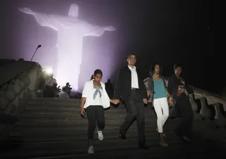 A Holy Vision - Mrs. Obama and daughters Sasha and Malia join the president on a visit to the famed Christ the Redeemer statue on Corcovado in Rio de Janeiro in March 2011. (Photo: REUTERS/Jason Reed)