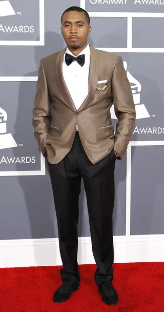 Nas - Smoking hot doesn’t only apply to the ladies. Nas shows the guys how it’s done in a custom tailored look from Brioni.  (Photo: REUTERS/Mario Anzuoni)