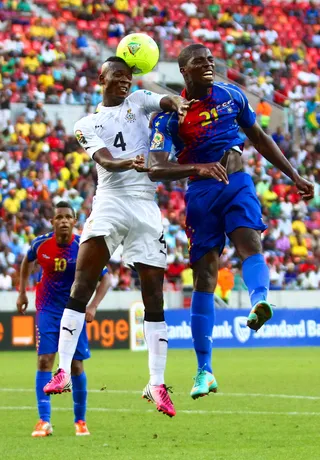 Bumping Heads - John Pantsil of Ghana and Jorge Djaniny Semedo of Cape Verde Islands clash during the quarterfinal match between Ghana and Cape Verde Islands on Feb. 2. Ghana won 2-0. (Photo:&nbsp; Richard Huggard/Gallo Images/Getty Images)