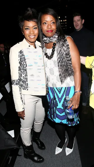 Divine Design - Angela Bassett gives fashion designer Tracy Reese a big hug after a fabulous presentation of her Fall 2013 collection with TRESemme during Mercedes-Benz Fashion Week in New York City.(Photo: Astrid Stawiarz/Getty Images for TRESemme)