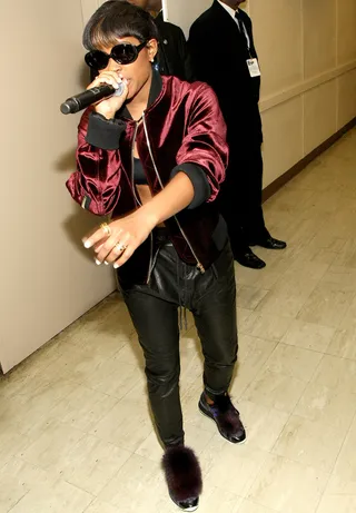 Making Sure Your Mic Works Backstage - Rapper DeJ Loaf tests out her sound before rocking out.(Photo: Bennett Raglin/BET/Getty Images for BET Networks)