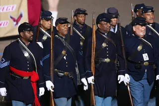 Paying Tribute to the Past - Performers dressed in Civil War-era uniforms march during the parade. (Photo: Mark Wilson/Getty Images)