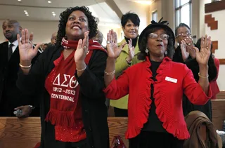 Clap Your Hands - Inauguration watchers at Ebenezer Baptist Church in Atlanta clap after the swearing-in of President Barack Obama.&nbsp;&nbsp; (Photo: REUTERS/Tami Chappell)