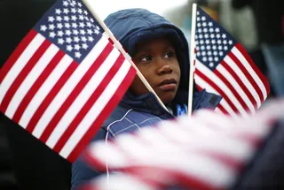 /content/dam/betcom/images/2013/01/National-01-16-01-31/012113-national-inauguration-crowd-reactions-3-patriotic-american-flag-child.jpg