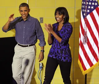 The First Couple Serves - The first couple spent about an hour staining a bookshelf prior to addressing volunteers as part of the National Day of Service. (Photo by Martin H. Simon-Pool/Getty Images)