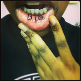 T'yanna Wallace @tyanna810 - Notorious B.I.G.'s daughter T'yanna Wallace pays homage to her rap legend father by getting his name inked on the inside of her lip.(Photo: Instagram via T'yanna Wallace)