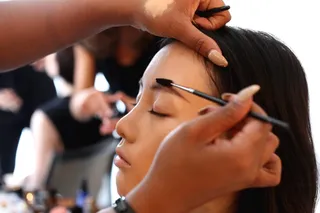 Brows On Fleek - A brow spoolie brush and creamy concealer help shape this model’s brows to perfection.(Photo: Bennett Raglin/Getty Images for BET)