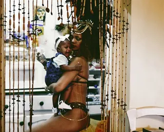 Time Out - RiRi shares a quiet moment with her niece during a break from the festivities.&nbsp; (Photo: Rihanna via Instagram)