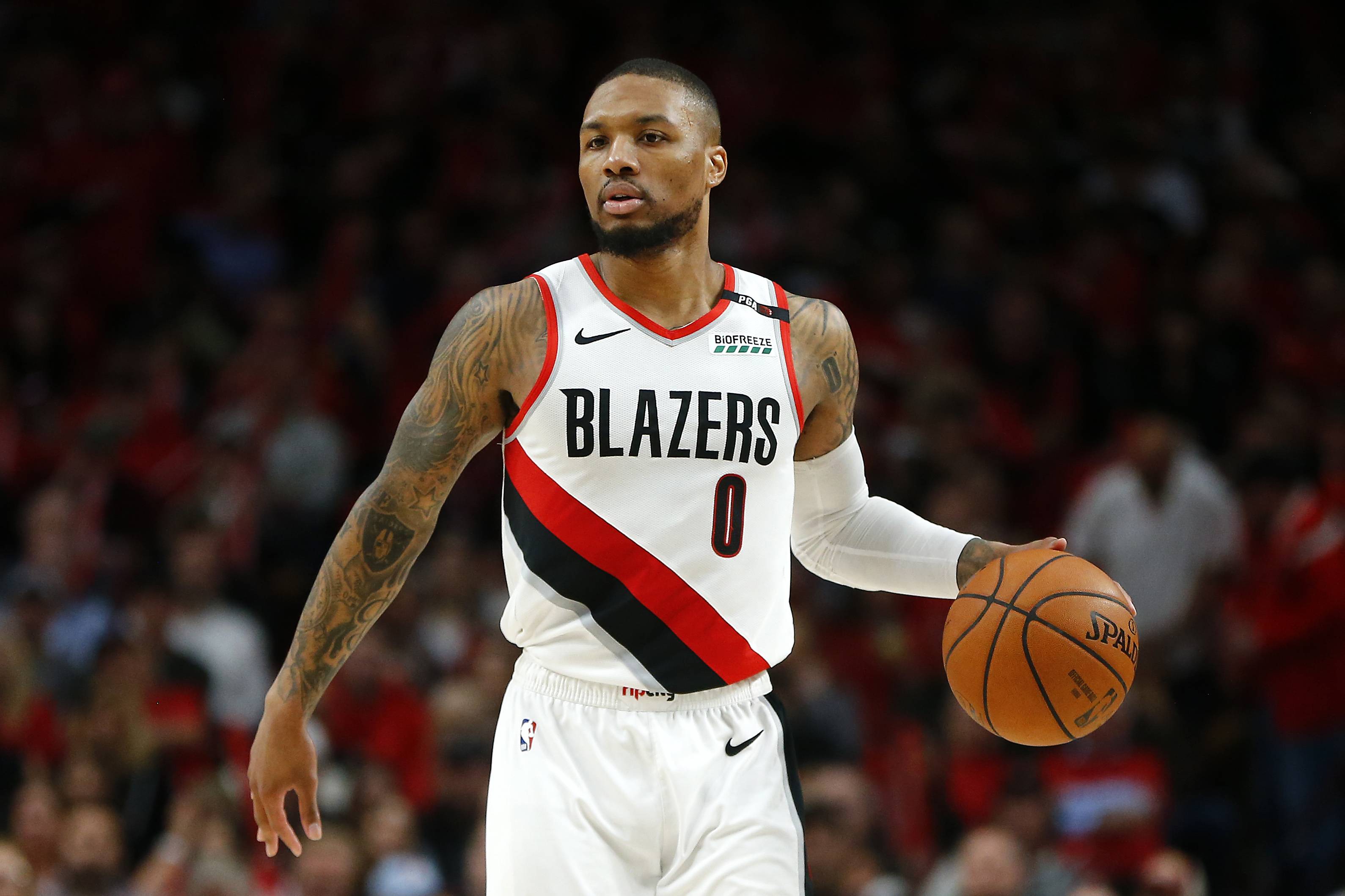 PORTLAND, OREGON - MAY 20: Damian Lillard #0 of the Portland Trail Blazers handles the ball during the second half against the Golden State Warriors in game four of the NBA Western Conference Finals at Moda Center on May 20, 2019 in Portland, Oregon. NOTE TO USER: User expressly acknowledges and agrees that, by downloading and or using this photograph, User is consenting to the terms and conditions of the Getty Images License Agreement. (Photo by Jonathan Ferrey/Getty Images)