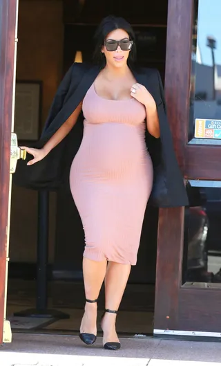 Baby Pink - Pregnant Kim Kardashian dresses up her baby bump in a cute knit baby pink dress while running errands in Los Angeles.(Photo: PacificCoastNews)