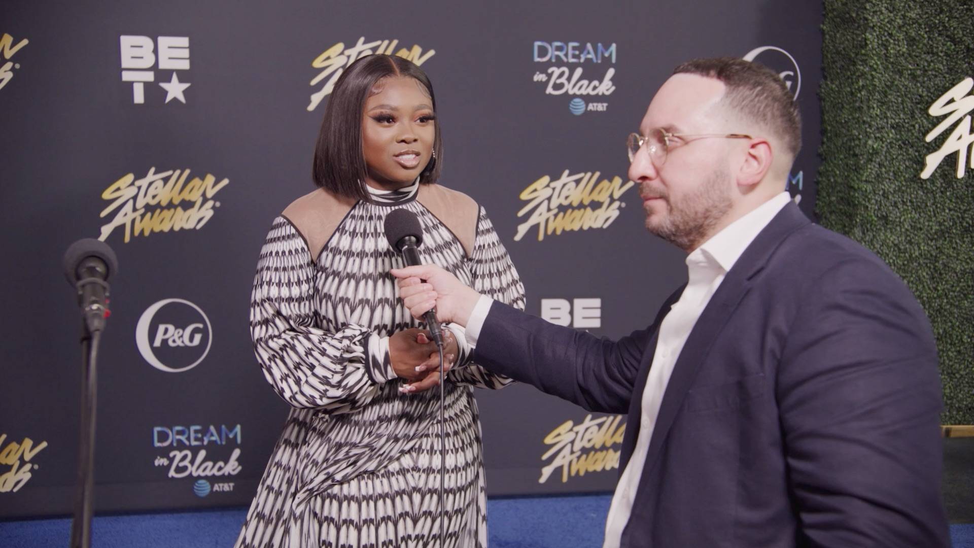 Jekalyn on the Stellar Awards blue carpet.