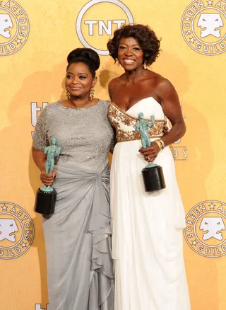 Clean Sweep - Actresses Octavia Spencer and Viola Davis take home additional awards for their roles in the summer film The Help. Spencer and Davis have already picked up Critics Choice Awards and Golden Globes. Here the ladies pose with their trophies for Outstanding Performance By a Cast in a Motion Picture at the 18th Annual Screen Actors Guild Awards at the Shrine Auditorium in Los Angeles. (Photo: Jason Merritt/Getty Images)