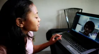 Wonders of Technology - Officer Morgan has a video chat with her sister. Technology has made it easier for the two to keep in touch.  (Photo: BET)