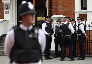 U.K. Gets an App for Stop and Search - A multicultural group of men banded together to create a mobile phone app that they hope will make stop and searches easier to understand.(Photo: Oli Scarff/Getty Images)