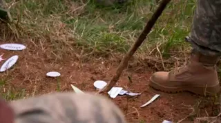 Following the Leader - Aziz gives instruction to the other cadets using scrap paper as a makeshift map.  (Photo: BET)