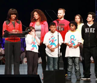 On the Move - First lady of the United States Michelle Obama addresses the crowd on stage with the Nike athletes and local school kids during the unveiling of the "Let's Move Active Schools" initiative to help schools create physical activity programs for students at McCormick Place in her hometown of Chicago.&nbsp;(Photo: Barry Brecheisen/Getty Images for Nike)