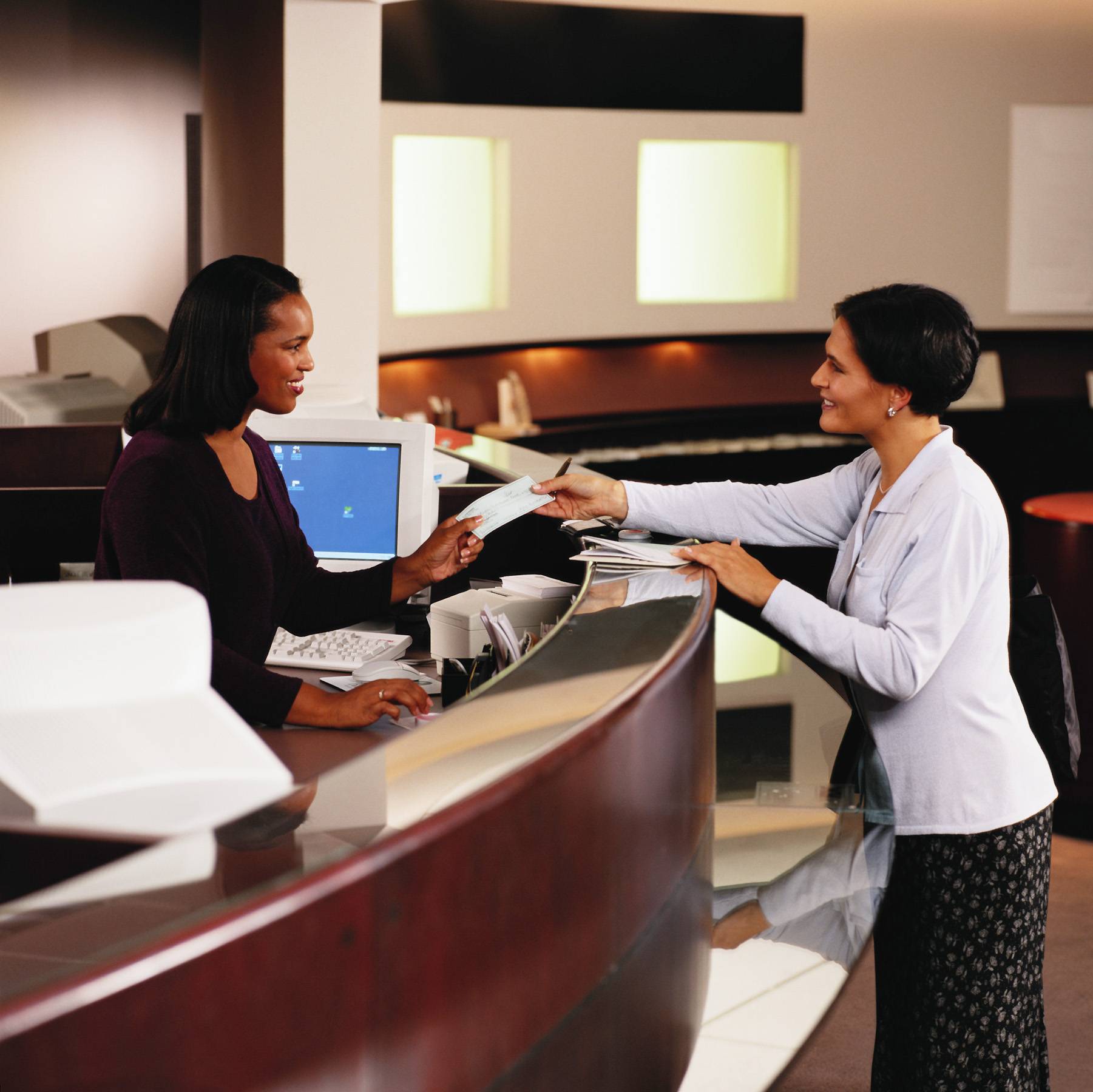 woman at the bank with bank teller