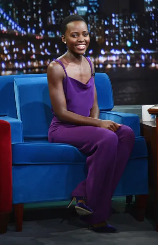 Fashion Darling - Lupita Nyong'o&nbsp;is stunning in a purple jumpsuit as she chats on the couch at Late Night With Jimmy Fallon at Rockefeller Center in New York City.  (Photo: Theo Wargo/Getty Images)