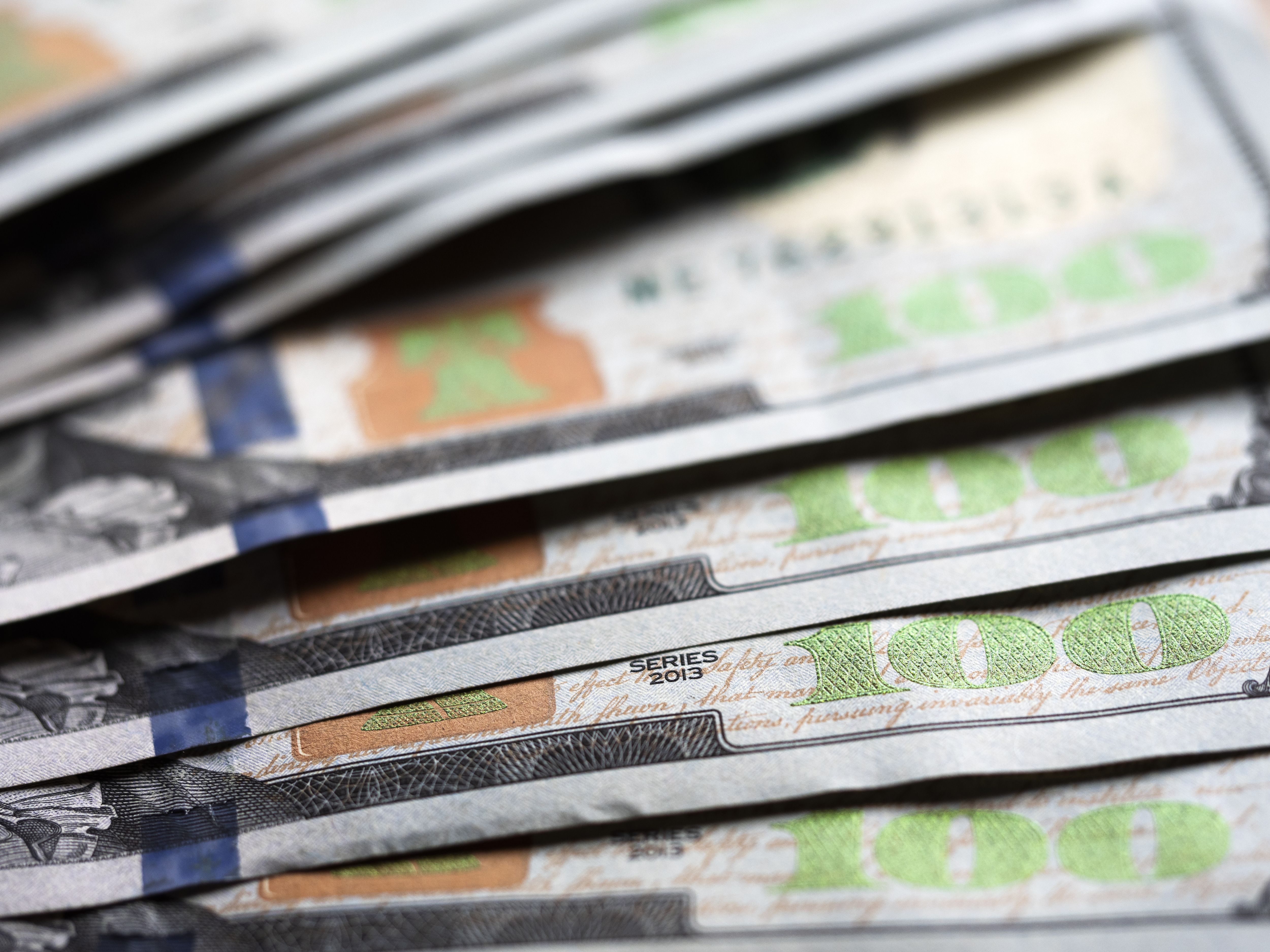 UKRAINE - 2020/07/09: A photo illustration of US 100 dollar bills. (Photo Illustration by Igor Golovniov/SOPA Images/LightRocket via Getty Images)