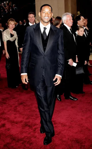 Will Smith Suits - Who looks better in a suit than Will Smith? Just his name conjures images on sleek three pieces and modern, casual suits. Tall grooms: take a page out of Will's book and make sure that your pants aren't high water while walking down the aisle. (Photo: Getty Images)