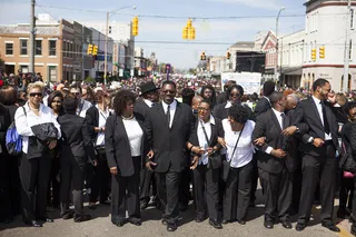 Army of One - Civilians join hands as they prepared to cross the bridge like those who did 50 years ago.&nbsp;(Photo: Ty Wright/BET)