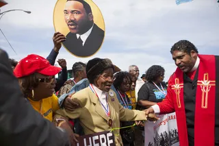 Glad You Could Make It - Rev. William Barber II shakes hands with some of the elders in the crowd who came out to march.&nbsp;(Photo: Ty Wright/BET)