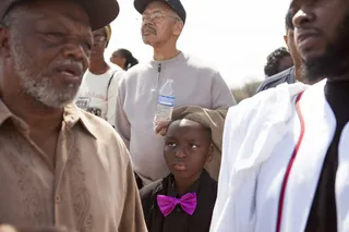 Serious Business - A young boy listens intently to the conversation between two adults during the march.&nbsp;(Photo: Ty Wright/BET)