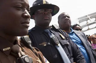 A United Front - Police watch as the march begins in Selma. The presence of Black law enforcement is a glaring sign of changes since 1965.&nbsp;(Photo: Ty Wright/BET)