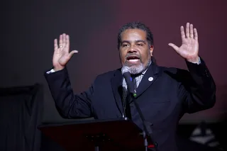 Hands Up - Speaker rallies the crowd with the "hands up" symbol -- a power tool used during many protests surrounding the death of Michael Brown in Ferguson.&nbsp;(Photo: Ty Wright for BET)
