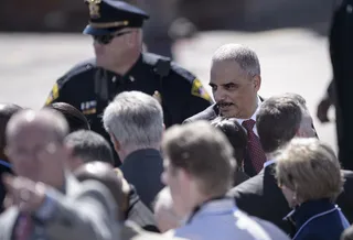 More Arrivals - US Attorney General Eric H. Holder Jr. shakes the hands of fellow constituents as he arrives at the Edmund Pettus Bridge in Selma.&nbsp;(Photo: BRENDAN SMIALOWSKI/AFP/Getty Images)