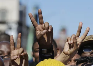 Peace - A crowd of supporters put up the &quot;peace&quot; sign to represent the feelings of many in Selma today.(Photo: AP Photo/Gerald Herbert)