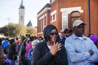 Bursting With Excitement - Two attendees eagerly waited for the 50th anniversary festivities to begin outside of the historic Brown Chapel AME Church.(Photo: Ty Wright for BET)