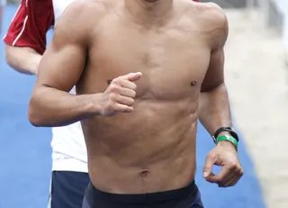 I Luh Ya Papi - This guy going for a run on the beach obviously has zero percent body fat. Who could it be?  (Photo: Jean Baptiste Lacroix/WireImage)&nbsp;