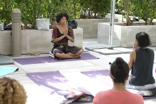 Finding Peace - Yoga enthusiasts grabbed their mats and settled in for a session with instructor Christina Pearce at the Yoga Master Class. (Photo: Gustavo Caballero/Getty Images)