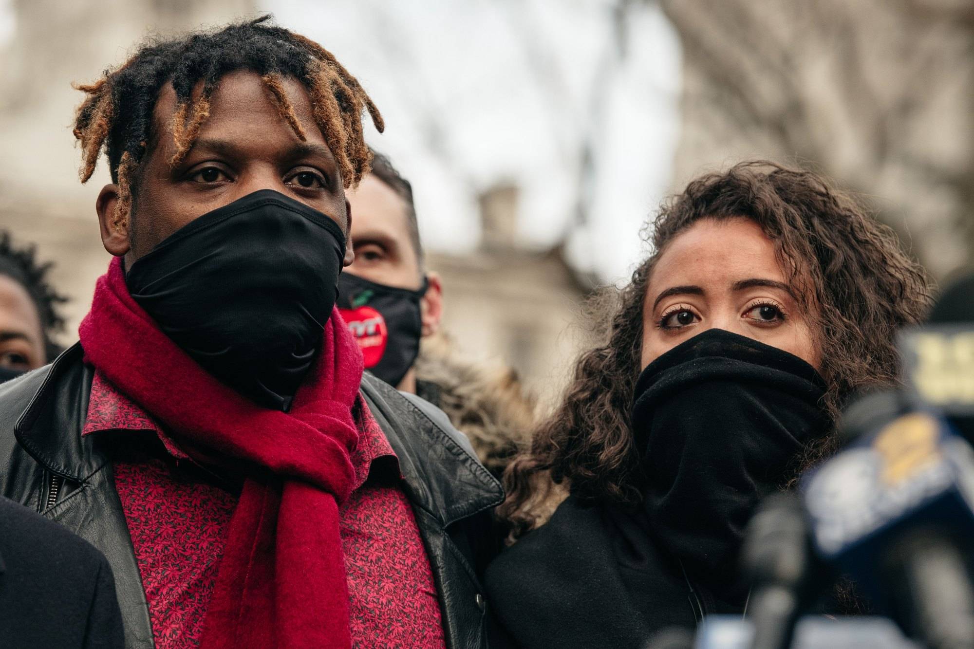 NEW YORK, NY - DECEMBER 30: Keyon, left, and Kat Harrold, right, look on at a press conference held in lower Manhattan on December 30, 2020 in New York City. After Harrold shared video footage of a white woman assaulting his son and wrongfully accusing the boy of stealing her phone in a Manhattan hotel lobby, civil rights leaders have called for an end to persistent racial profiling and injustice. (Photo by Scott Heins/Getty Images)