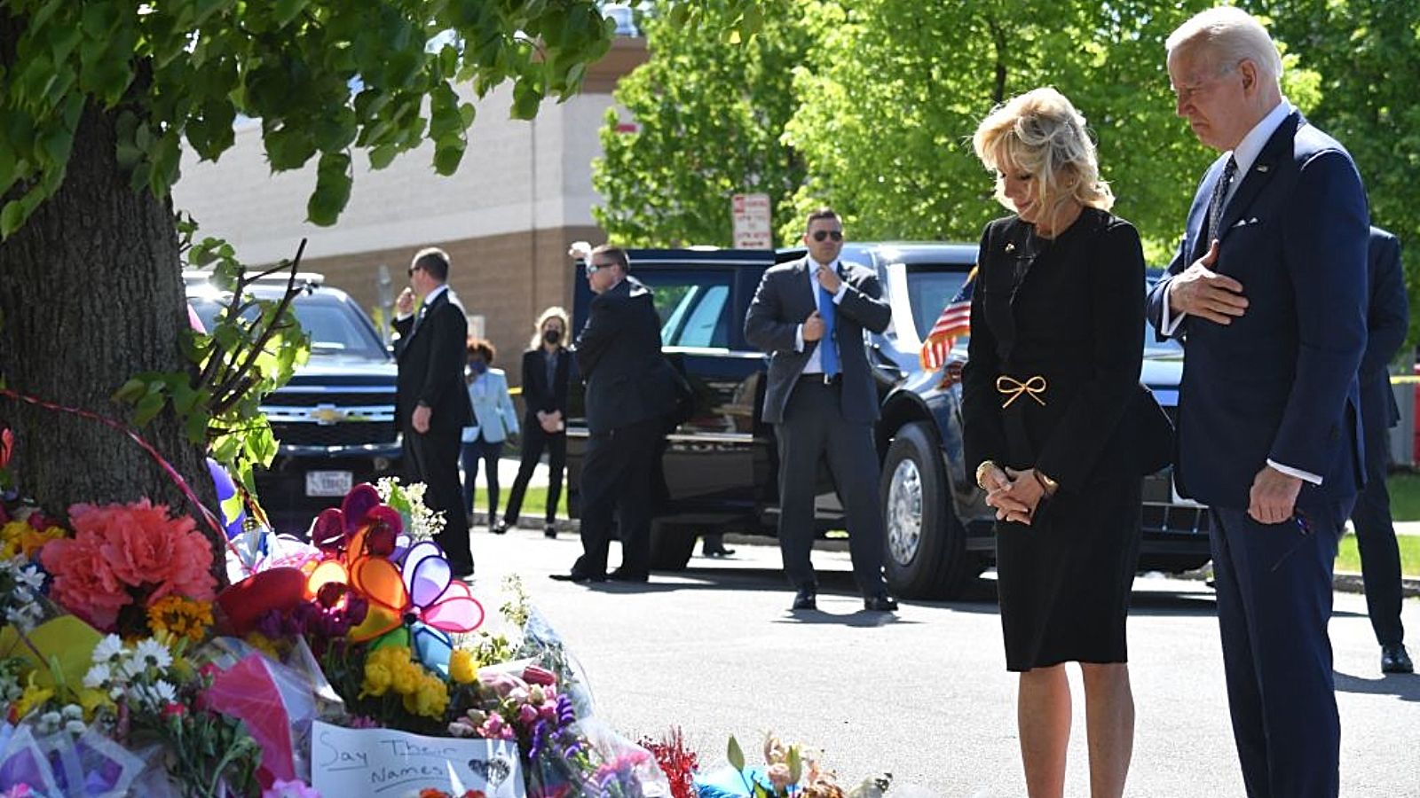 US President Joe Biden and US First Lady Jill Biden visit a memorial near a Tops grocery store in Buffalo, New York, on May 17, 2022. - Biden is visiting Buffalo after ten people were killed in a mass shooting at a grocery store on May 14, 2022.  