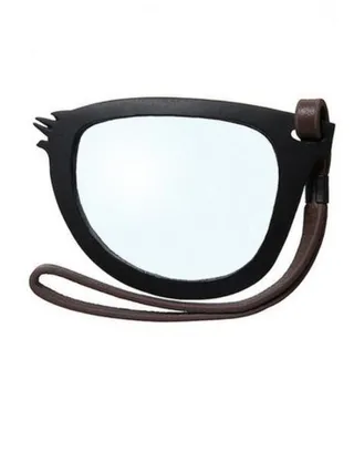 Marc Jacobs Magnifying Eye Glass ($25) - Function meets fashion with this faux broken glasses piece. It'll help you read the fine print on everything from work contracts to shopping tags.  (Photo: Marc Jacobs)