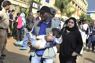 Helping Out - The mall had been hosting a children's day event. (Photo: AP Photo/Riccardo Gangale)