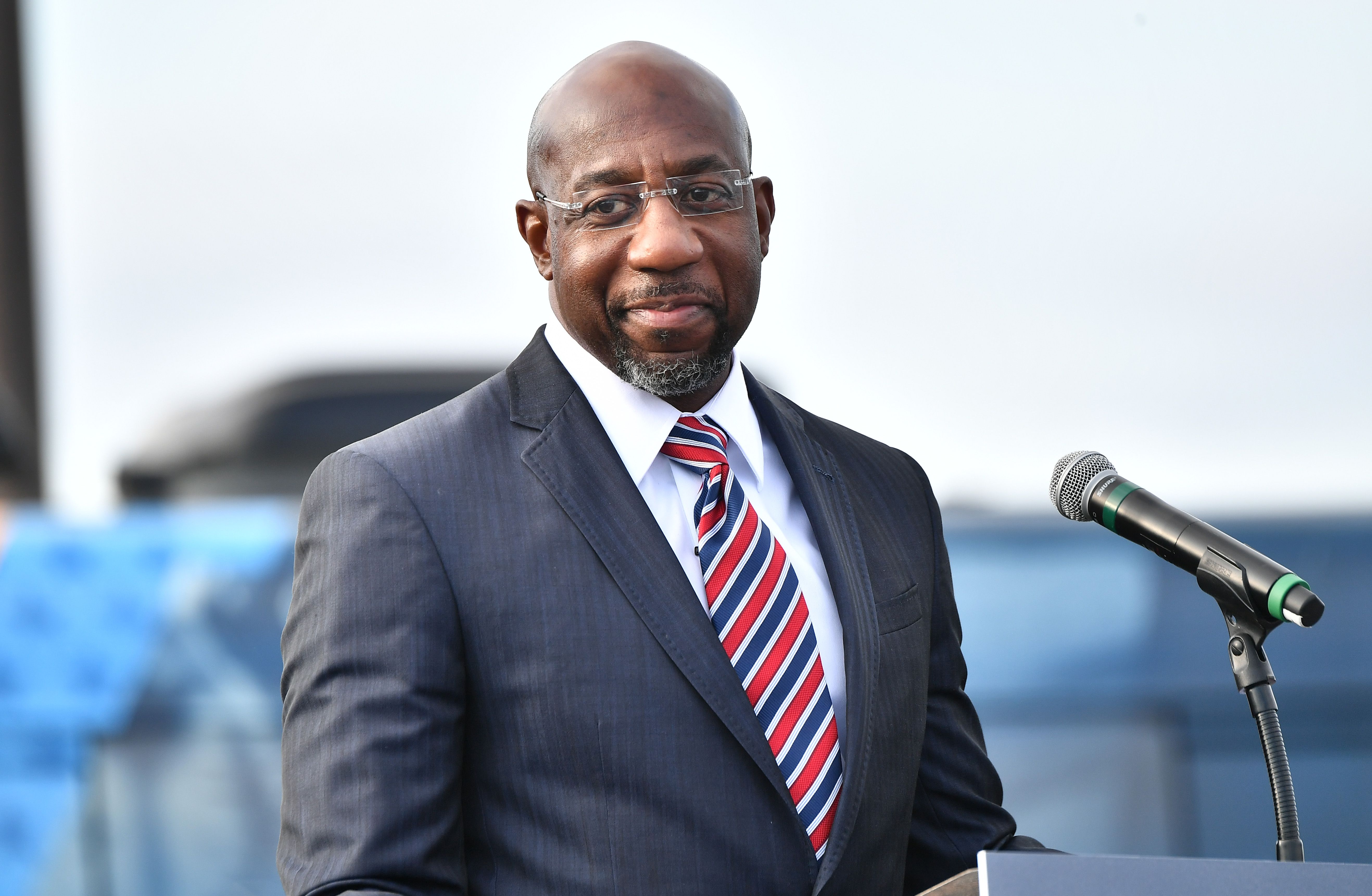 STONECREST, GEORGIA - DECEMBER 28:  Georgia Democratic Senate candidate Raphael Warnock speaks onstage during the "Vote GA Blue" concert on December 28, 2020 in Stonecrest, Georgia. (Photo by Paras Griffin/Getty Images)
